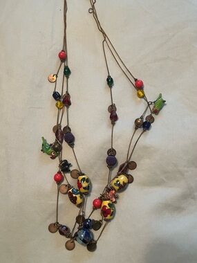 Vintage glass bead necklace with three chains.
